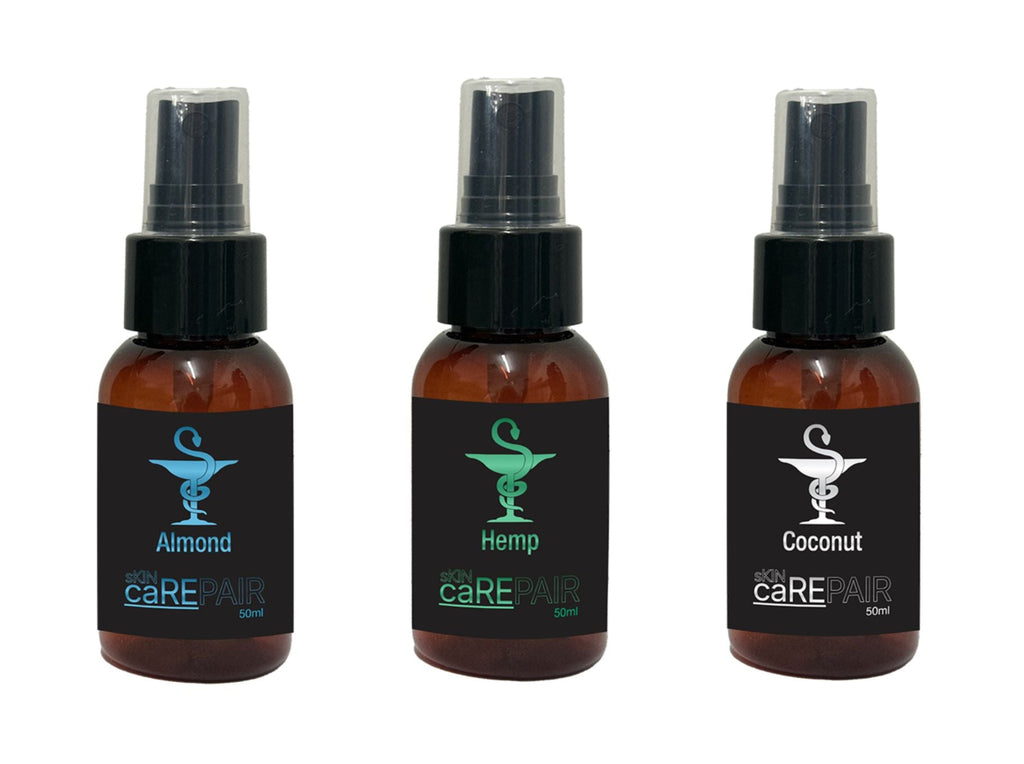 Three small spray bottles with a brand logo on a white background